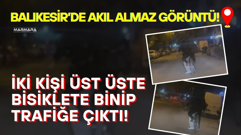 Balıkesir’de gece saatlerinde iki kişinin üst üste binerek bisikletle ilerlemesi